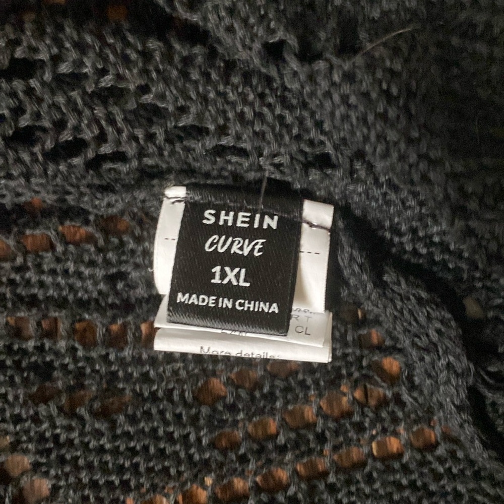 Black cardigan from SHEIN it’s a 1X